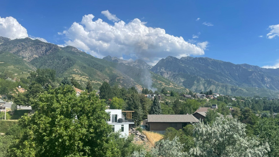 Smoke is billowing from a house fire in Cottonwood Heights Monday. (Courtesy: Emily Hunt)...