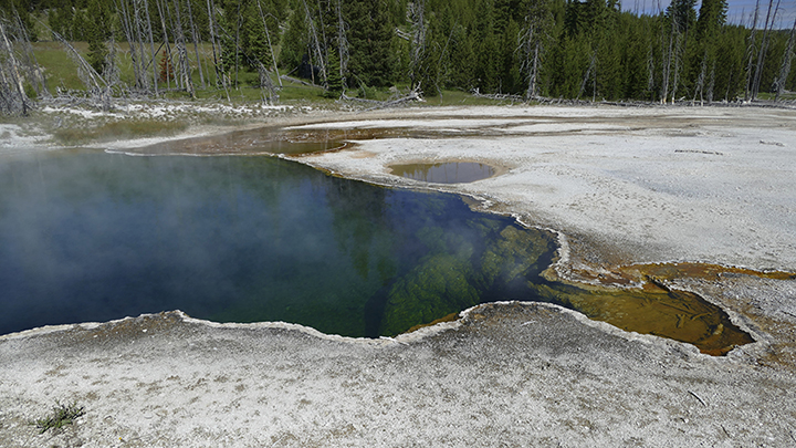 In this photo provided by the National Park Service is the Abyss Pool hot spring in the southern pa...