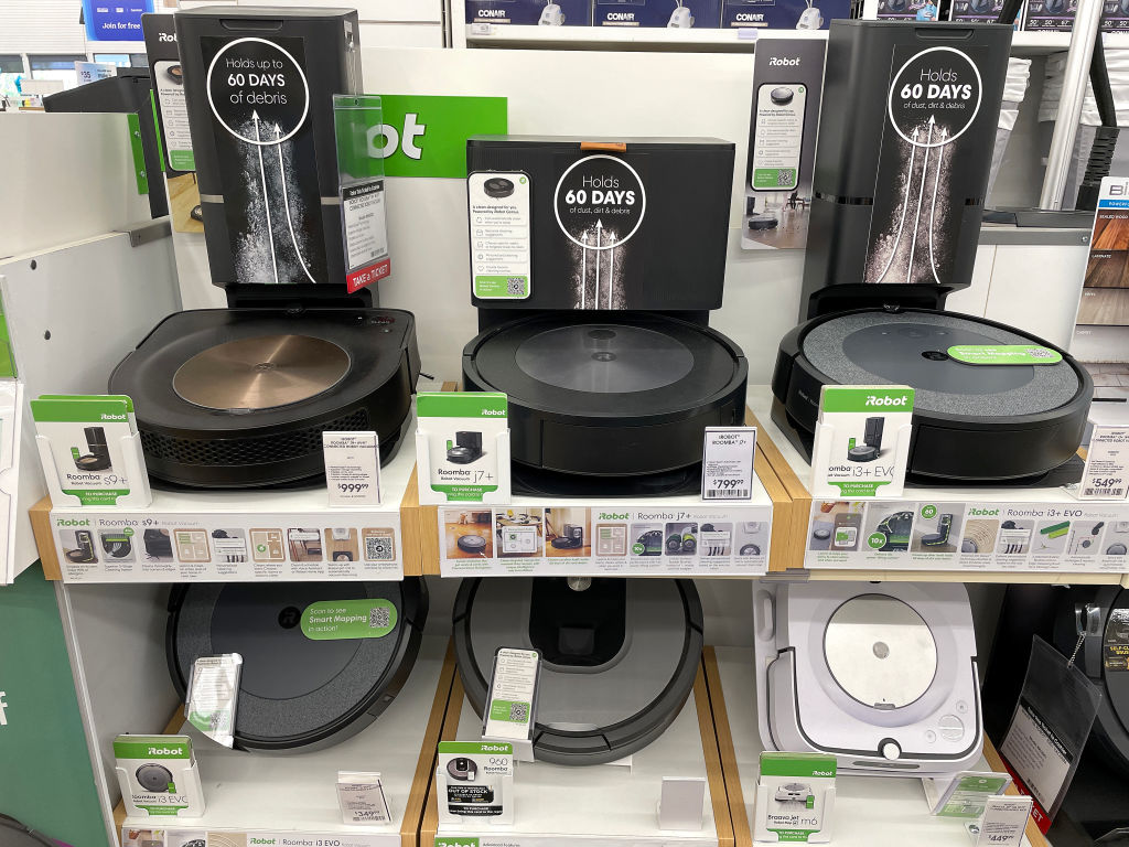 LARKSPUR, CALIFORNIA - AUGUST 05: Roomba robot vacuums made by iRobot are displayed on a shelf at a...