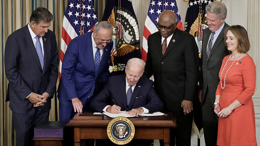 WASHINGTON, DC - AUGUST 16: U.S. President Joe Biden (C) signs The Inflation Reduction Act with (L-...