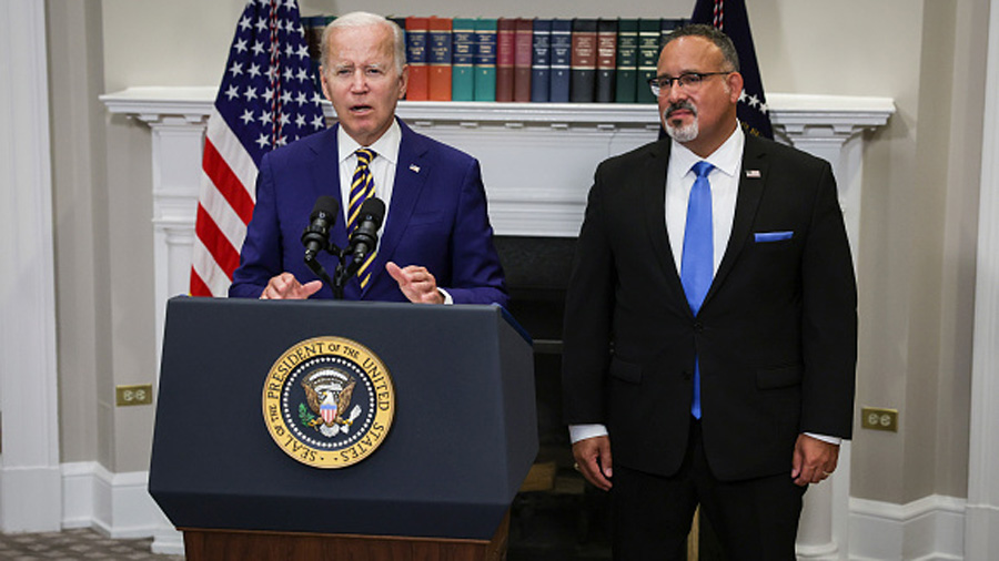 WASHINGTON, DC - AUGUST 24: U.S. President Joe Biden, joined by Education Secretary Miguel Cardona,...