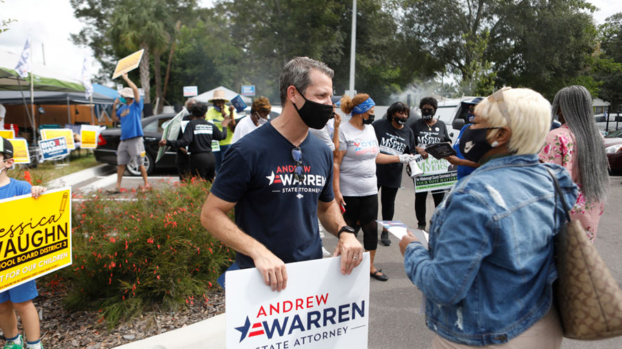 TAMPA, FL - NOVEMBER 01: Hillsborough County State Attorney Andrew Warren talks to a voter during t...