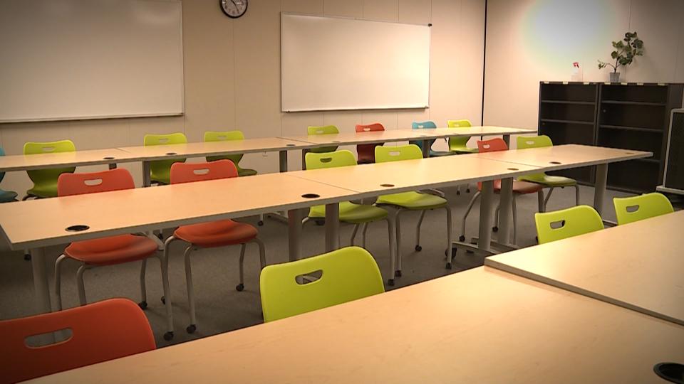 A school classroom with chairs and desks...