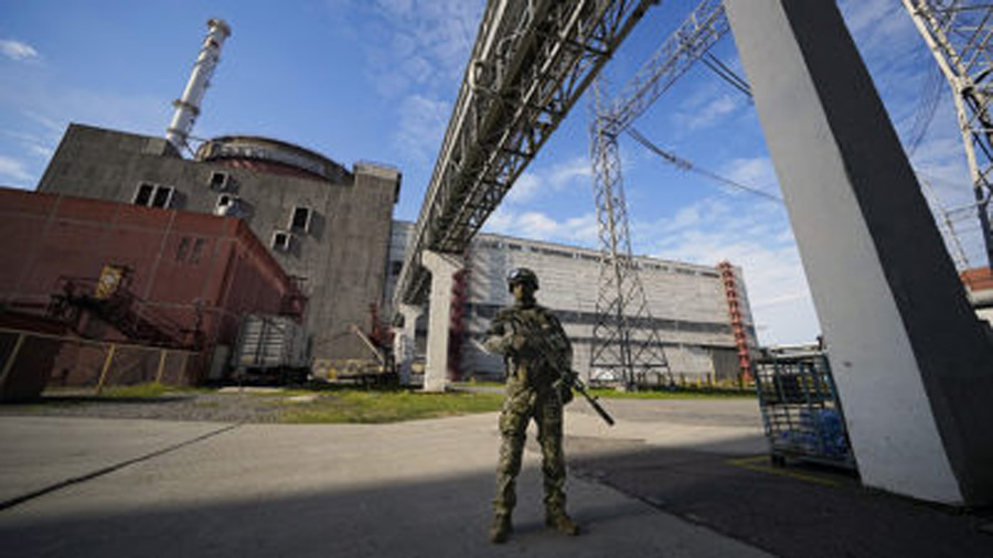 FILE - A Russian serviceman guards an area of the Zaporizhzhia Nuclear Power Station in territory u...