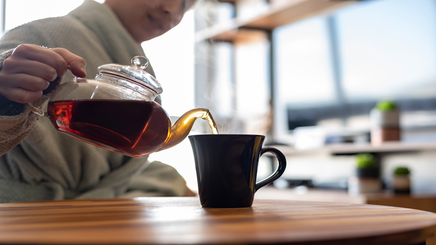 Woman serving herself a cup of black tea. Marcela Vieira/iStockphoto/Getty Images
30 Aug 22...