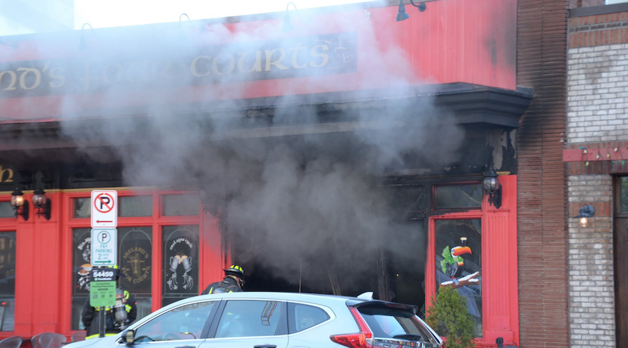 Firefighters at Ireland's Four Courts pub and restaurant in Arlington, Virginia after a vehicle cra...