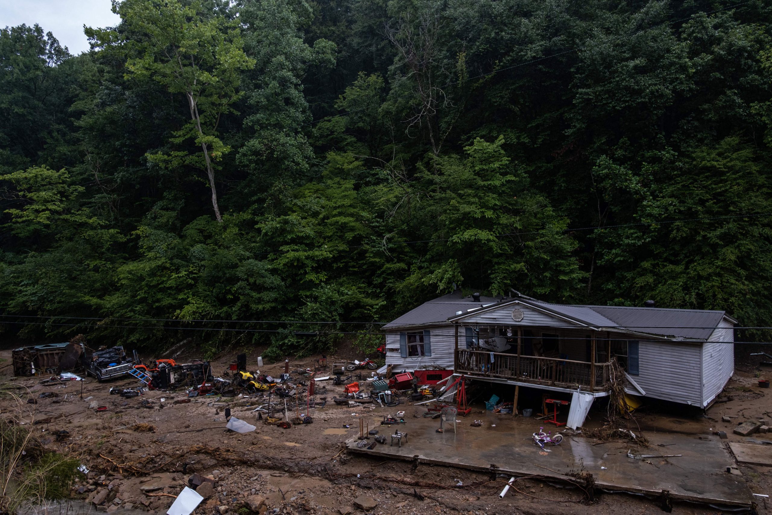 Debris surrounds a badly damaged home near Jackson, Kentucky, on July 31, 2022, after historic floo...