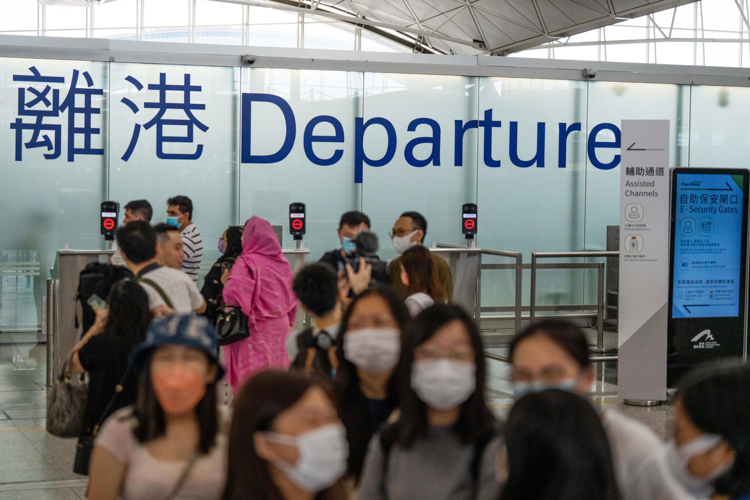 Travelers in the departure hall at Hong Kong International Airport in Hong Kong, China, on Monday, ...