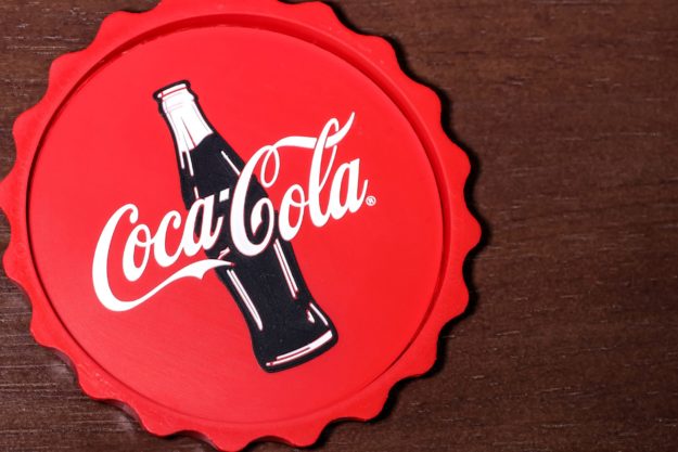 Coca-Cola coaster on wood table