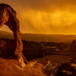 The sun sets as a rainstorm blows over Delicate Arch in Arches National Park near Moab on Saturday, Sept. 18, 2021. Spenser Heaps Deseret News