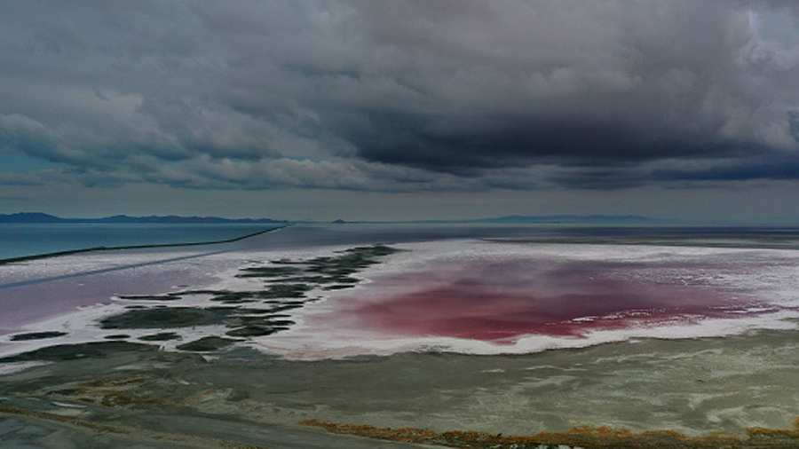 CORINNE, UTAH - AUGUST 02: In an aerial view, an evaporation pond is pinkish-red due to high salini...