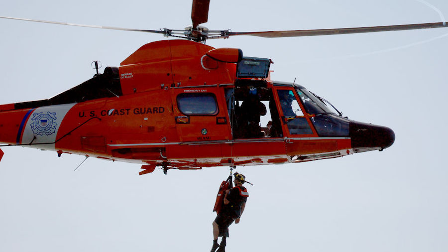 FILE: Crew members in a United States Coast Guard MH 65 Dolphin helicopter participate in a trainin...