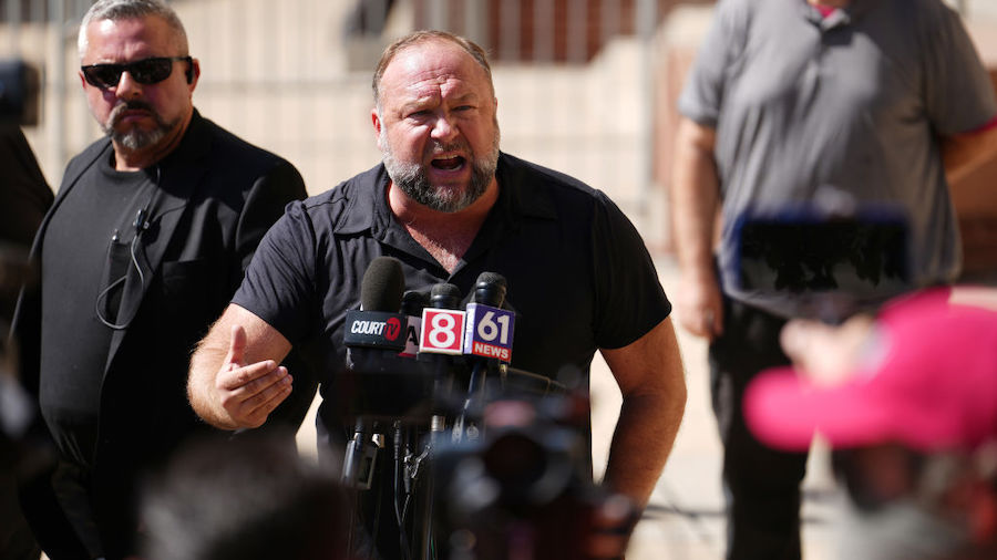 InfoWars founder Alex Jones speaks to the media outside Waterbury Superior Court during his trial o...