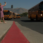 Principal Mary Heslop waves good bye to her students following their early dismissal. (KSL TV)fore noon Tuesday after early dismissal. (KSL TV)