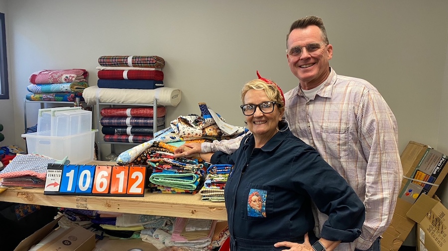 Hal and Gina Halladay pictured with their quilt counter, which has surpassed 10,000 quilts in six m...