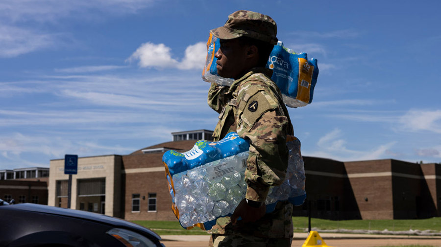 JACKSON, MS - SEPTEMBER 01: Members of the Mississippi National Guard hand out bottled water at Tho...