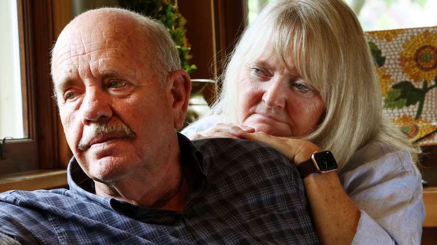 Ron and Sy Snarr, of Salt Lake City, pose for a photo on Friday, Aug. 19, after reading a letter fr...