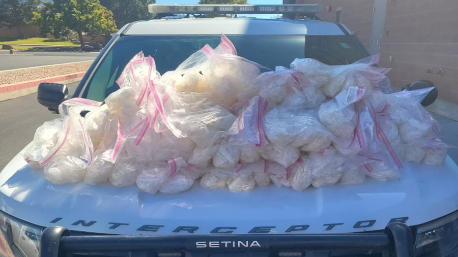 116 bags of methamphetamine are stacked on the hood of a UHP unit. (Utah Highway Patrol)...