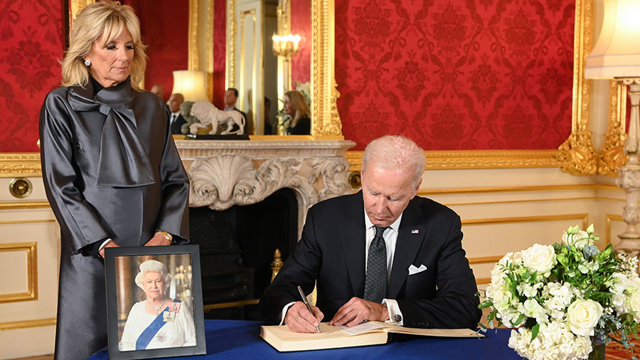 U.S. President Joe Biden, accompanied by the First Lady Jill Biden signs a book of condolence at La...