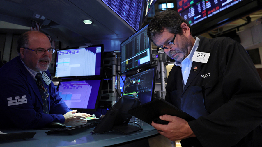 Traders work on the floor of the New York Stock Exchange (NYSE) in New York City, U.S., September 2...
