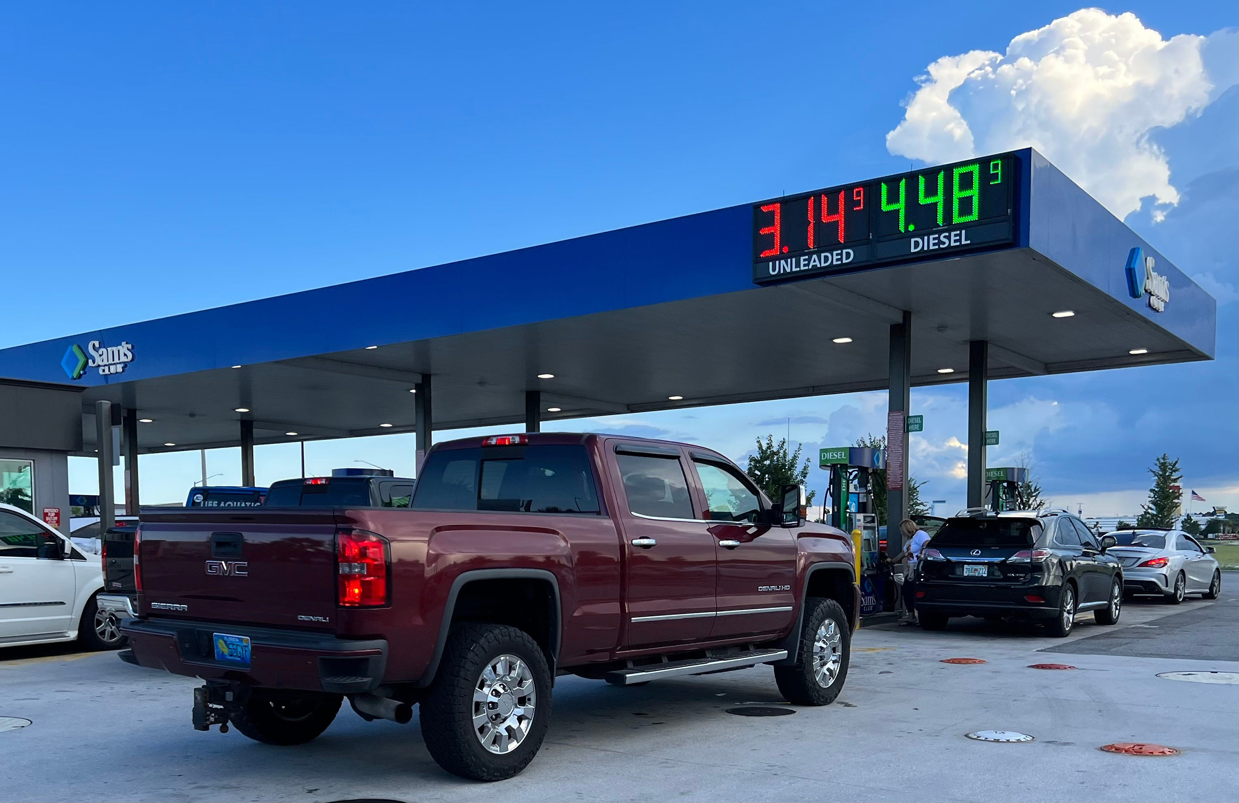 Cars line up at the members-only Sam's Club gas station next to the Interstate 95/LPGA Boulevard in...