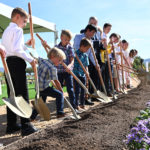 Invited guests ceremonially turn the dirt at the Heber Valley Temple groundbreaking in Heber City, Utah, on Saturday, October 8, 2022. (Intellectual Reserve, Inc.)