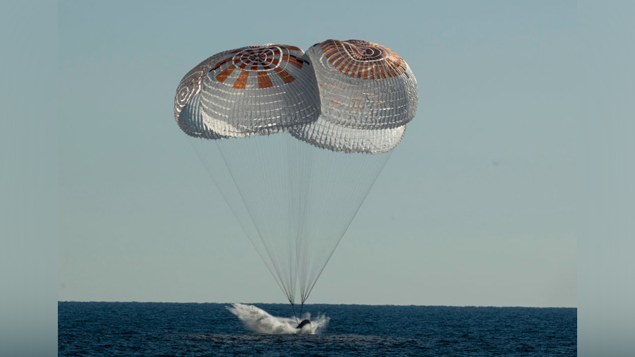 In this handout image provided by NASA, the SpaceX Crew Dragon Freedom spacecraft is seen as it lan...