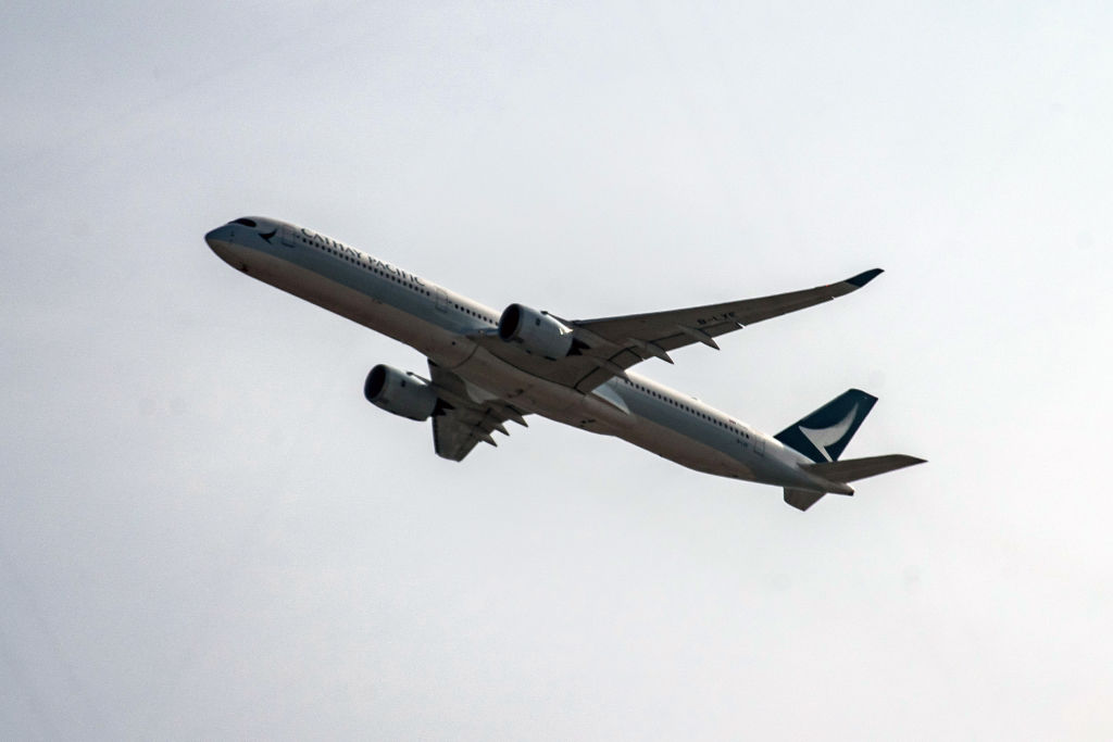 HONG KONG, CHINA - OCTOBER 21: A Cathay Pacific passenger jet takes off from Hong Kong Internationa...