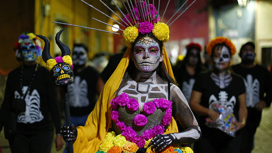 A woman dressed as a catrina participates during the parade of the "Day Of The Dead Festival" in Gu...