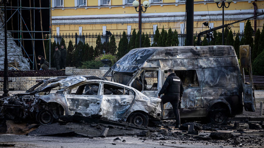 Emergency service personnel attend to the site of a blast on October 10, 2022 in Kyiv, Ukraine. Thi...