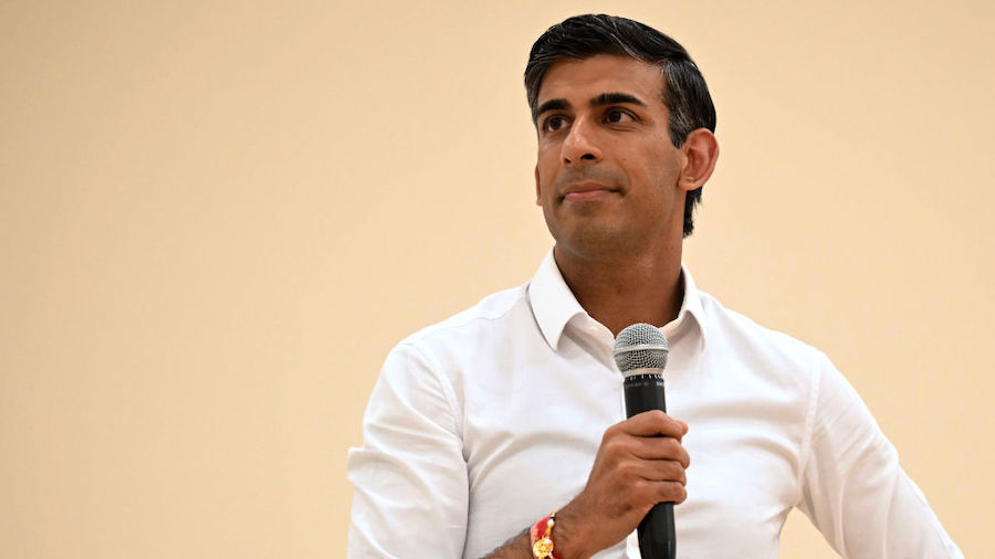 FILE: Rishi Sunak speaks to the audience during a Conservative Friends of India event at the Dhamec...