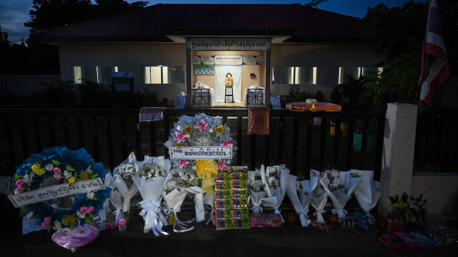 Toys, flowers and notes are left as offerings for the children that died in a mass shooting at a ch...