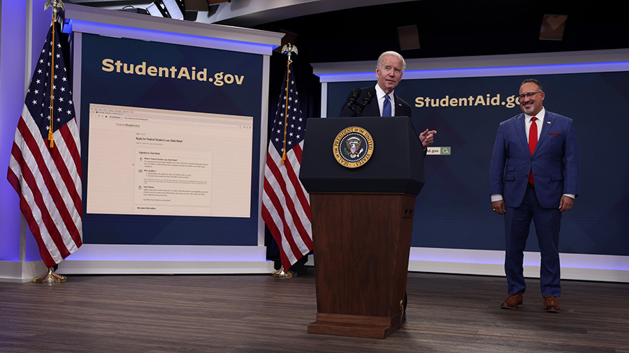 President Joe Biden speaks on the student debt relief plan as Secretary of Education Miguel Cardona...