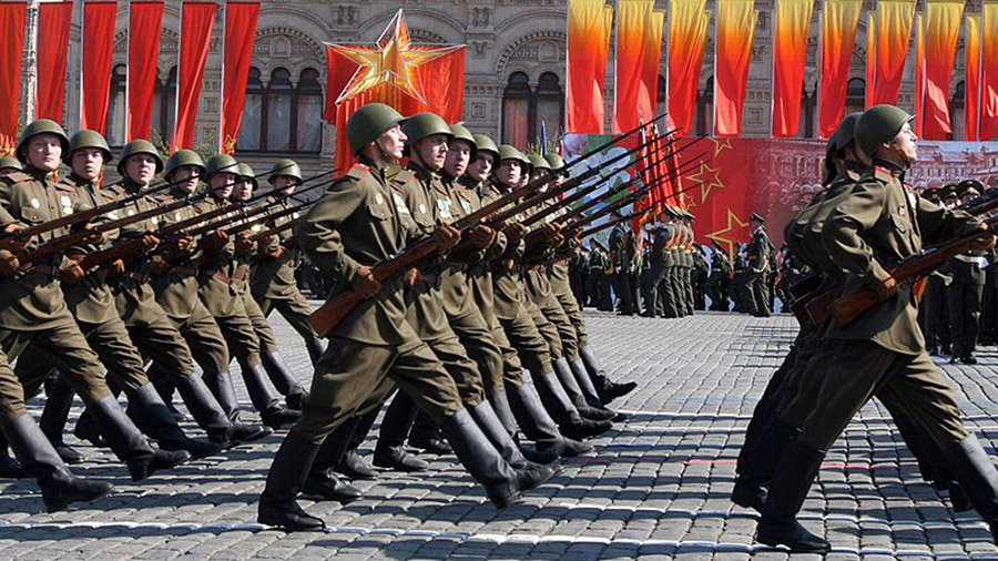 MOSCOW - MAY 9:  Russian military personnel, wearing Red Army uniforms, hold WWII era rifles as the...
