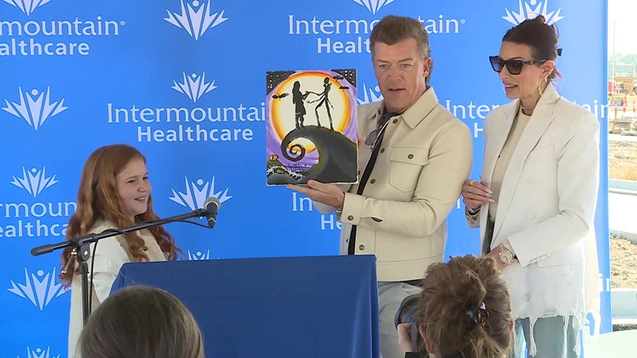 Todd and Andie Pedersen receiving a gift from a Primary Children's patient. (KSL TV)...