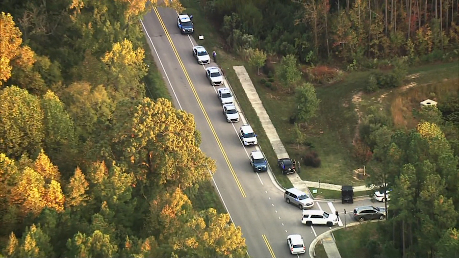 Law enforcement are pictured responding to a shooting in Raleigh, North Carolina, on October 13. A ...