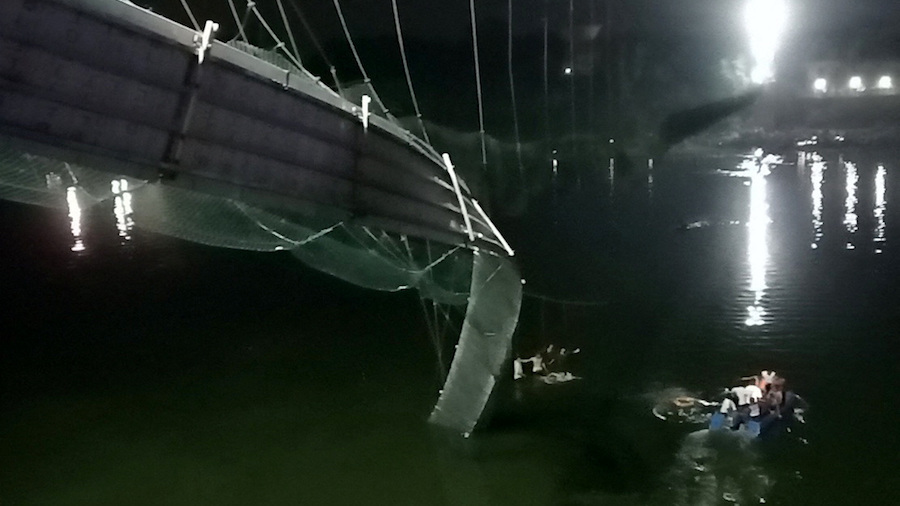 A view shows a damaged part of the suspension bridge in Morbi. (Stringer/Reuters via CNN)...