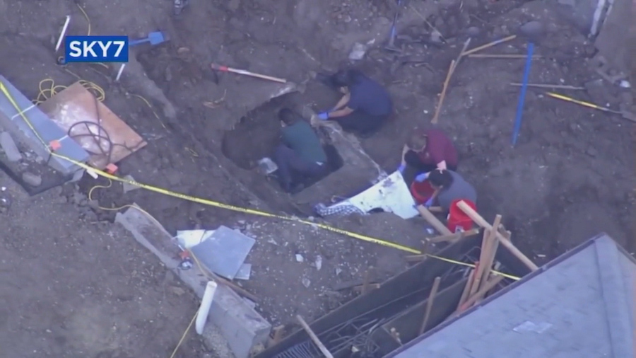 Authorities search a car that may have been buried for decades in Atherton, California. (KGO via CN...