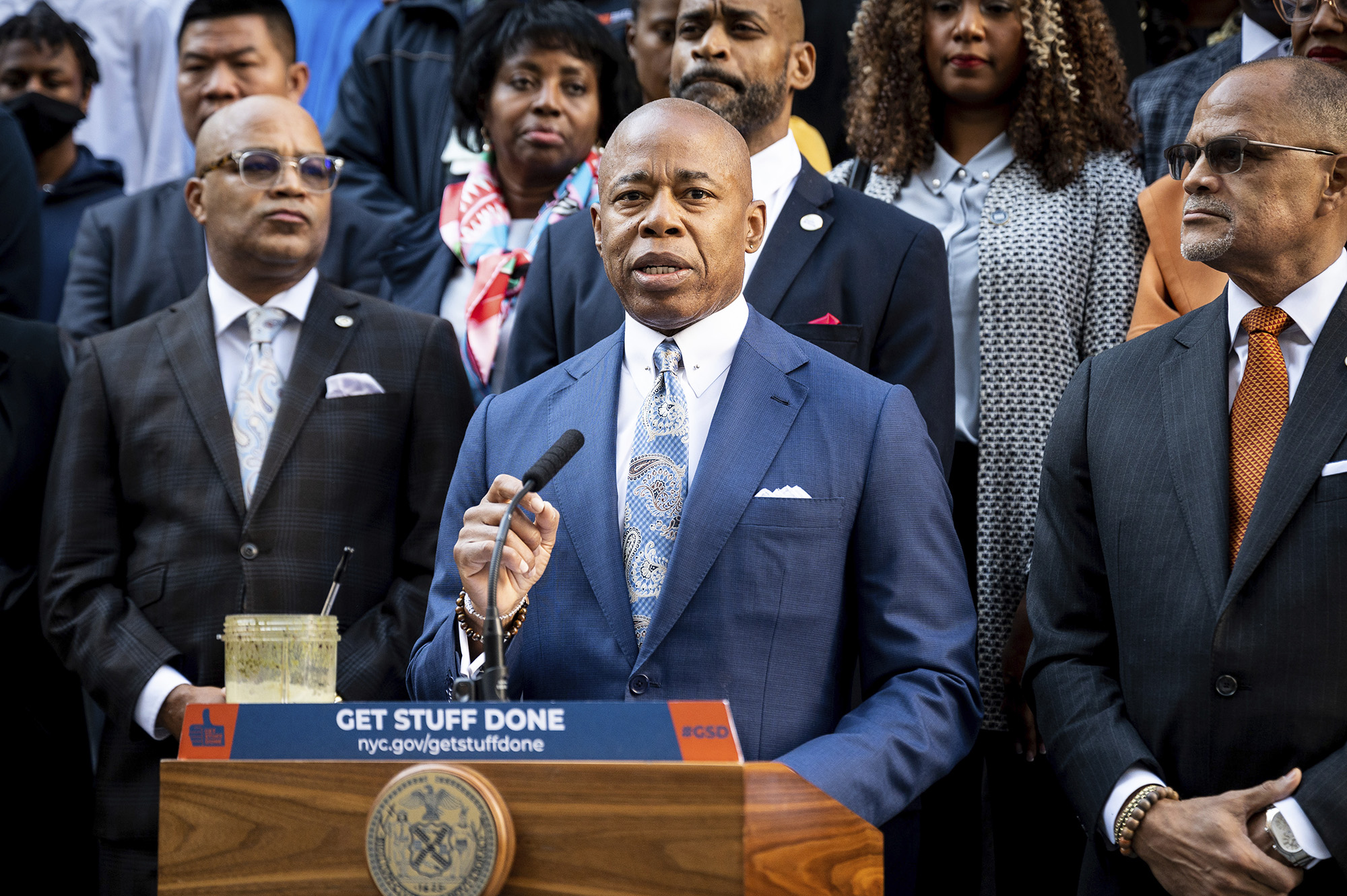 New York City Mayor Eric Adams (D) speaking at a press conference in front of the Tweed Courthouse ...