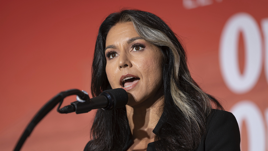 Tulsi Gabbard, here speaking at a rally on June 23, in Washington, says she's leaving the Democrati...