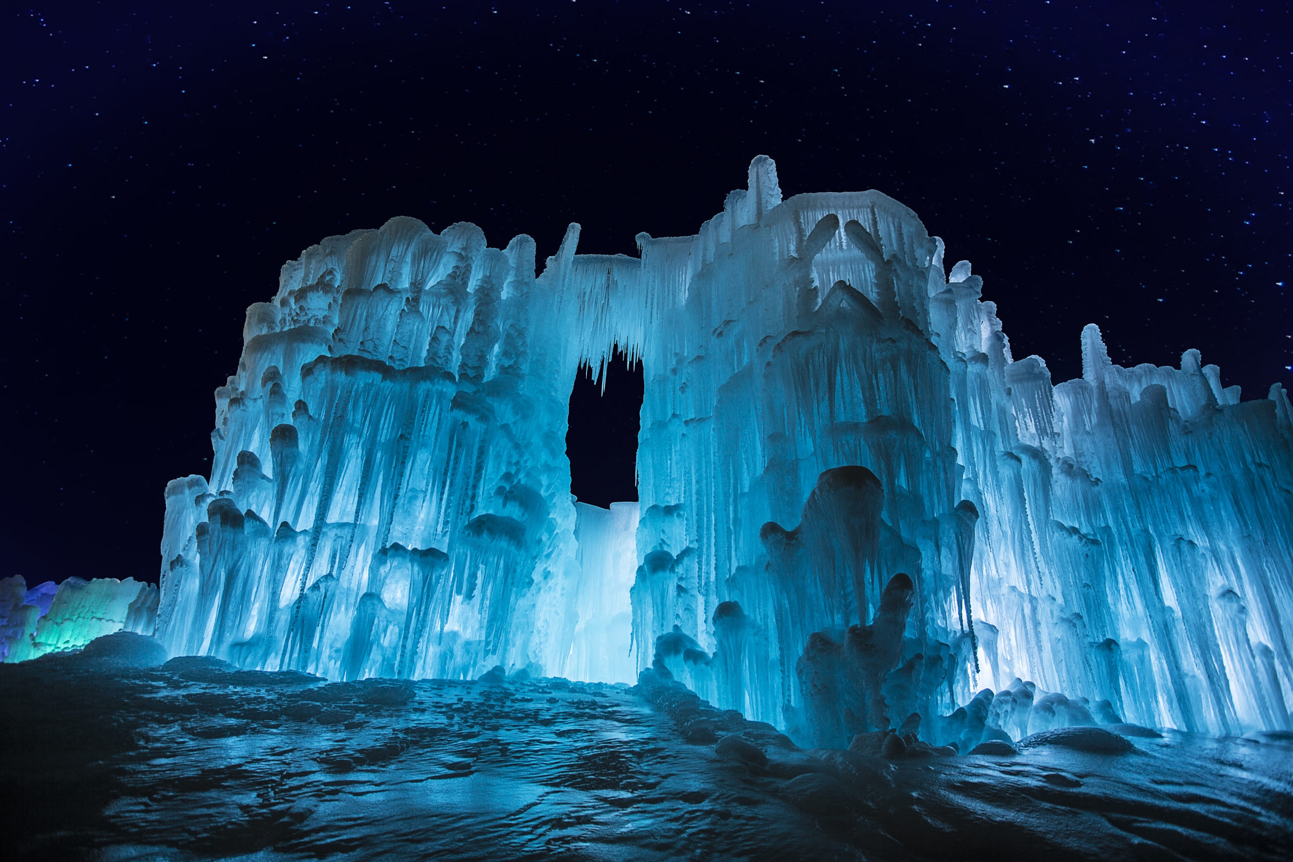 Massive blue ice sculptures with a starry sky....