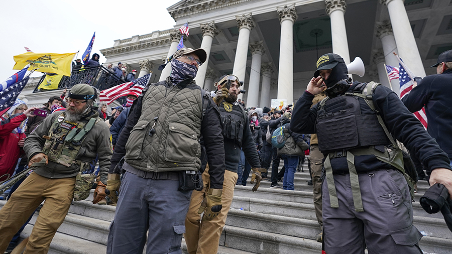 FILE - Members of the Oath Keepers on the East Front of the U.S. Capitol on Jan. 6, 2021, in Washin...