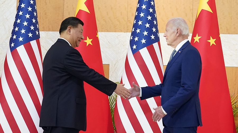 U.S. President Joe Biden, right, shakes hands with Chinese President Xi Jinping before their meetin...