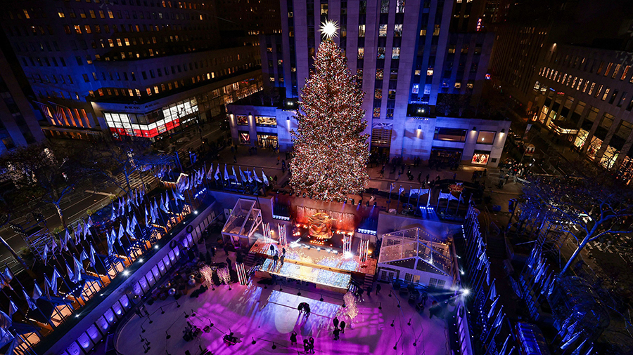 Massive Christmas tree is lit in front of the Rockefeller Center....
