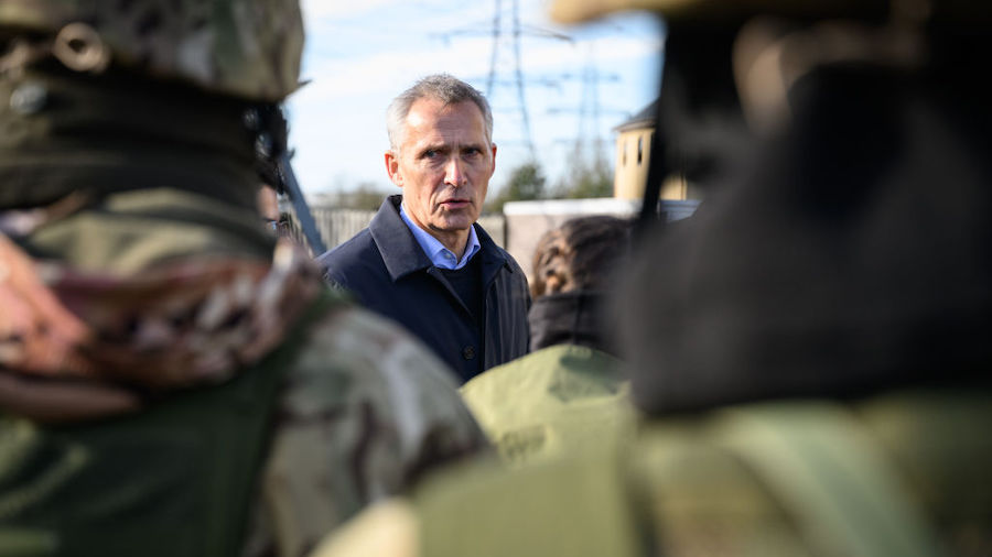 Secretary General of NATO Jens Stoltenberg speaks with personnel after observing Ukrainian troops b...
