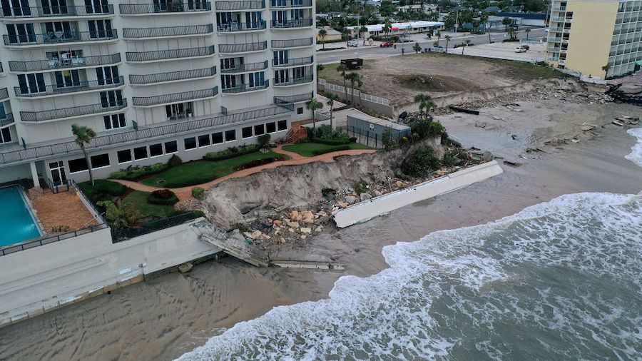 In this aerial view, seawalls along condo buildings are shown breached by Hurricane Nicole on Novem...