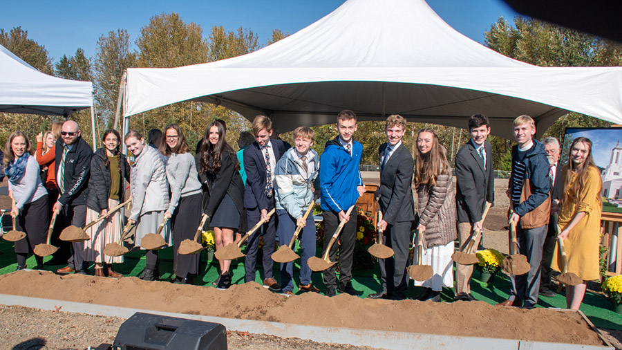 Invited guests, including Latter-day Saint youth from Oregon's Willamette Valley, turn the soil at ...