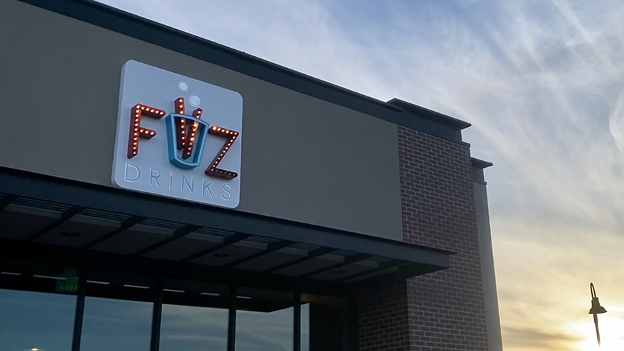 FiiZ sign on a storefront in Kaysville at sunset....