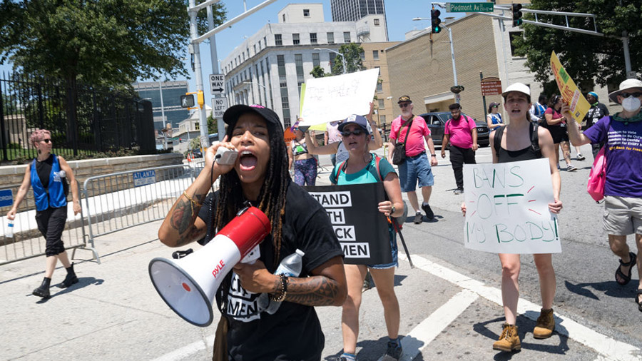 ATLANTA, GA - JULY 23: Protestors march and chant in Downtown Atlanta, in opposition to Georgia's n...