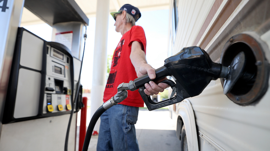 Lynn Gates pumps gas at Shopper’s Express in Salt Lake City on Thursday, June 2, 2022. (Kristin M...